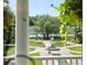 View of a landscaped backyard with a decorative fountain, inviting outdoor living and relaxation at 1972 Long Creek Rd, Wadmalaw Island, SC 29487