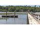Dockside view showcasing the private dock with a gazebo and railing leading to a boat lift at 1972 Long Creek Rd, Wadmalaw Island, SC 29487