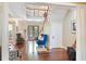 Grand foyer featuring a staircase, hardwood floors, and abundant natural light at 1972 Long Creek Rd, Wadmalaw Island, SC 29487