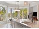 Bright and open kitchen, featuring a view to the dining area with lake and garden views at 1972 Long Creek Rd, Wadmalaw Island, SC 29487