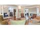 Bright, open living room with hardwood floors, columns, and views into multiple rooms at 1972 Long Creek Rd, Wadmalaw Island, SC 29487