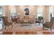 Elegant living room features hardwood floors, neutral decor, and a striking horse art piece at 1972 Long Creek Rd, Wadmalaw Island, SC 29487