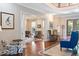 Elegant living room with hardwood floors, detailed trim, and comfortable seating at 1972 Long Creek Rd, Wadmalaw Island, SC 29487