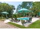 Inviting pool area with lounge chairs and lush landscaping at 1972 Long Creek Rd, Wadmalaw Island, SC 29487