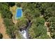 Private tennis court nestled within lush greenery and alongside a serene creek at 1972 Long Creek Rd, Wadmalaw Island, SC 29487