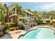 Inviting backyard with a sparkling blue swimming pool, patio area, and palm trees at 2 Pierates Cruz, Mount Pleasant, SC 29464