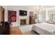 Spacious bedroom featuring a fireplace, television, closet and two dressers at 2 Pierates Cruz, Mount Pleasant, SC 29464