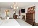 Primary bedroom featuring a fireplace, television, closet and two dressers at 2 Pierates Cruz, Mount Pleasant, SC 29464