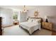 Bright bedroom featuring a plush bed, hardwood floors, and an abundance of natural light at 2 Pierates Cruz, Mount Pleasant, SC 29464