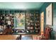 Stylish built-in bookshelves with a window seat, providing a cozy reading nook with natural light at 2 Pierates Cruz, Mount Pleasant, SC 29464
