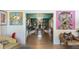 View from living room through to dining room with built-in bookshelves, chandelier, and hardwood floors at 2 Pierates Cruz, Mount Pleasant, SC 29464