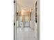 Hallway featuring built-in storage and white tile floors at 2 Pierates Cruz, Mount Pleasant, SC 29464