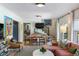 Open concept living area with a coral sofa, view into dining area, and staircase with decor at 2 Pierates Cruz, Mount Pleasant, SC 29464