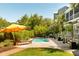 Inviting pool area with lounge chairs and umbrella, perfect for outdoor relaxation and entertaining at 2 Pierates Cruz, Mount Pleasant, SC 29464