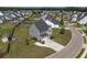 Aerial view of the home, showcasing the lush green lawn and a charming storage shed at 2113 Pimlico Dr, Ridgeville, SC 29472