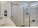 Bright bathroom with double sinks, a large framed mirror, and a glass-enclosed shower with a built-in seat at 2113 Pimlico Dr, Ridgeville, SC 29472