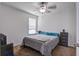 Bedroom with ceiling fan, window, carpet flooring, bed with teal accents, and modern nightstand with drawers at 2113 Pimlico Dr, Ridgeville, SC 29472