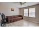 Inviting living room featuring new flooring, a ceiling fan, and two windows with natural light at 2113 Pimlico Dr, Ridgeville, SC 29472