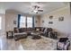 Inviting living room features plush sectional sofa, area rug, and natural light, perfect for relaxing or entertaining at 2113 Pimlico Dr, Ridgeville, SC 29472