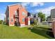 Large backyard features a lush lawn and beautiful surrounding homes at 218 Barberry St, Summerville, SC 29483