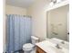 Cozy bathroom with a sink, toilet and shower with blue shower curtain at 218 Barberry St, Summerville, SC 29483