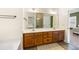 Bright bathroom with double sink vanity, large mirror and walk-in shower at 218 Barberry St, Summerville, SC 29483
