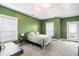 Spacious bedroom with a trey ceiling, carpet flooring, and a private balcony entrance at 218 Barberry St, Summerville, SC 29483