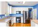 Modern kitchen features white cabinets, stainless steel appliances and a hardwood floor at 218 Barberry St, Summerville, SC 29483