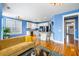 Open-concept living room with a kitchen featuring stainless steel appliances and a breakfast bar at 218 Barberry St, Summerville, SC 29483