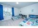 Cozy bedroom with two twin beds and a window at 222 Torslanda Ln, Summerville, SC 29486