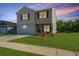Inviting two-story home with well-kept lawn and landscaping at 222 Torslanda Ln, Summerville, SC 29486