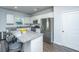 Modern kitchen featuring granite countertops, stainless steel appliances, a kitchen island with seating, and white cabinetry at 222 Torslanda Ln, Summerville, SC 29486