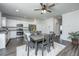 Bright kitchen with white cabinets, stainless steel appliances, granite countertops, and an adjacent dining area at 222 Torslanda Ln, Summerville, SC 29486