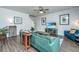Bright living room featuring hardwood floors, a staircase, and stylish furnishings at 222 Torslanda Ln, Summerville, SC 29486