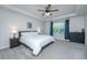 Bright main bedroom with a ceiling fan, tray ceiling, and large window for natural light at 222 Torslanda Ln, Summerville, SC 29486
