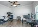 Large office space with multiple monitors, exercise bike, and hardwood floors at 222 Torslanda Ln, Summerville, SC 29486