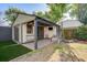 Cozy backyard studio with a covered patio, outdoor seating, and lush greenery at 229 Gordon St, Charleston, SC 29403