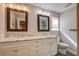 Bright bathroom featuring double sinks with marble countertops and decorative framed mirrors at 229 Gordon St, Charleston, SC 29403
