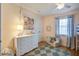 Bright bedroom with a cozy reading chair, dresser, and hardwood floors, perfect for a space at 229 Gordon St, Charleston, SC 29403