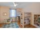 Bright bedroom with bunk beds, complemented by hardwood floors and a cozy armchair at 229 Gordon St, Charleston, SC 29403
