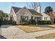 Charming traditional home with a brick chimney, mature trees, and a private driveway at 229 Gordon St, Charleston, SC 29403