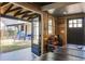 Wood paneled game room with ping pong table, backyard view, and sports equipment at 229 Gordon St, Charleston, SC 29403
