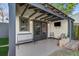 Charming outdoor patio with comfortable seating, overlooking a manicured lawn at 229 Gordon St, Charleston, SC 29403