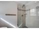 Modern tiled shower featuring glass doors and sleek fixtures, enhanced by stylish accent tiles at 229 Gordon St, Charleston, SC 29403