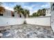 Private backyard patio with tiled flooring, providing an inviting outdoor living space at 23 Felix St, Charleston, SC 29403