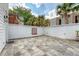 Spacious backyard patio with tiled flooring, perfect for outdoor gatherings and relaxation at 23 Felix St, Charleston, SC 29403