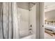 Bright bathroom features a shower-tub combo with white subway tile and a stylish decorative shower curtain at 23 Felix St, Charleston, SC 29403