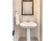 Bathroom featuring pedestal sink, framed mirror, and tile flooring at 23 Felix St, Charleston, SC 29403