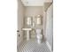 Classic bathroom with pedestal sink, black and white mosaic tile floor, and a shower with curtain at 23 Felix St, Charleston, SC 29403