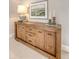 Elegant wooden dresser with decorative accents and ambient lighting in a neutral-toned room at 23 Felix St, Charleston, SC 29403